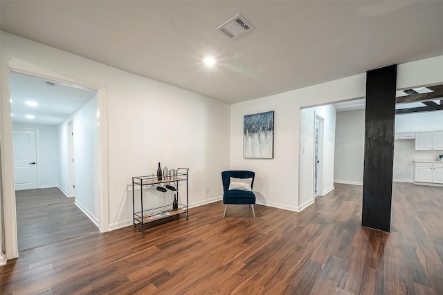 living area with dark hardwood / wood-style floors