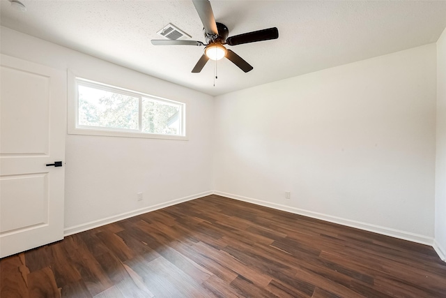 unfurnished room with dark wood-type flooring and ceiling fan