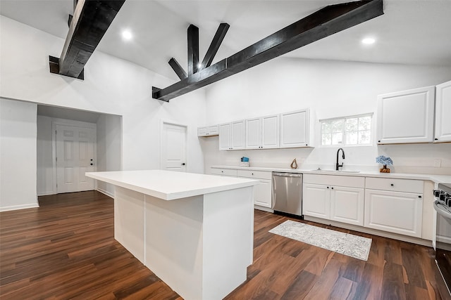 kitchen with sink, a center island, appliances with stainless steel finishes, dark hardwood / wood-style floors, and white cabinets