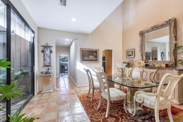 dining room with a high ceiling