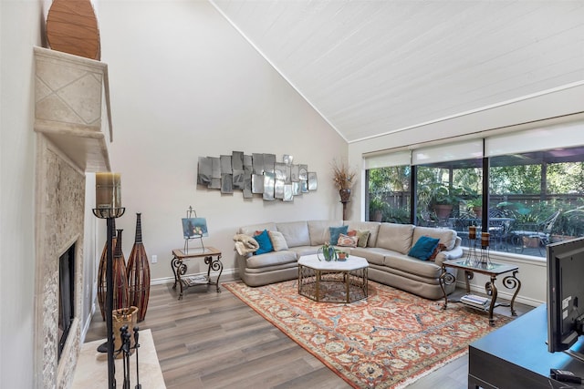 living room with lofted ceiling and hardwood / wood-style floors