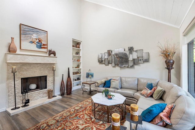 living room featuring ornamental molding, lofted ceiling, and hardwood / wood-style floors