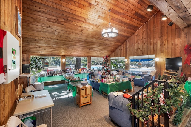 living room featuring wooden walls, carpet floors, and wooden ceiling