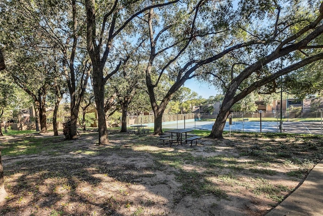 surrounding community featuring tennis court