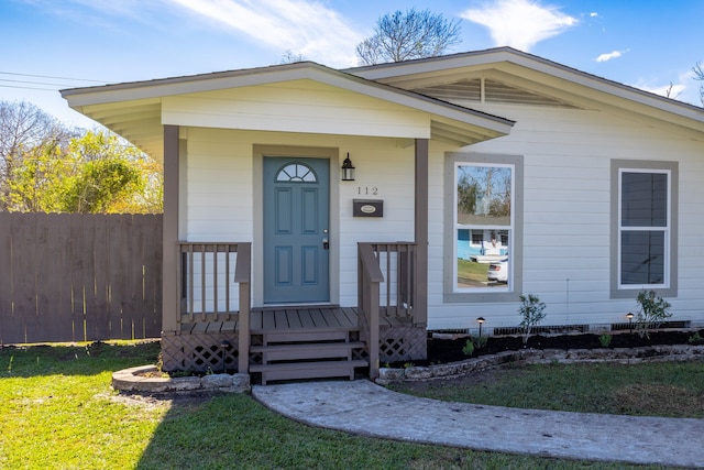 bungalow-style home with a front lawn