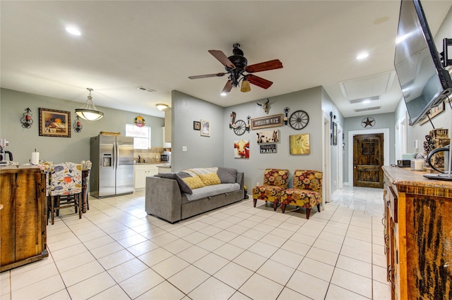 tiled living room featuring ceiling fan