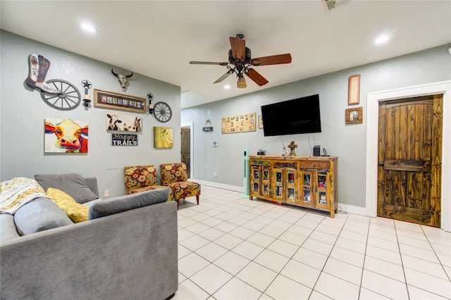 tiled living room with ceiling fan