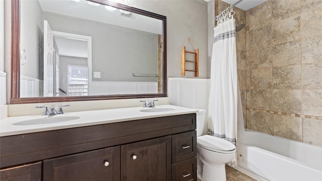 full bathroom with shower / bath combination with curtain, tile patterned floors, vanity, and toilet