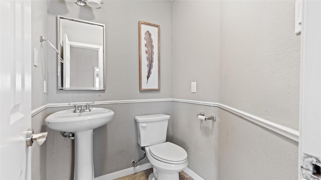 bathroom with sink and toilet