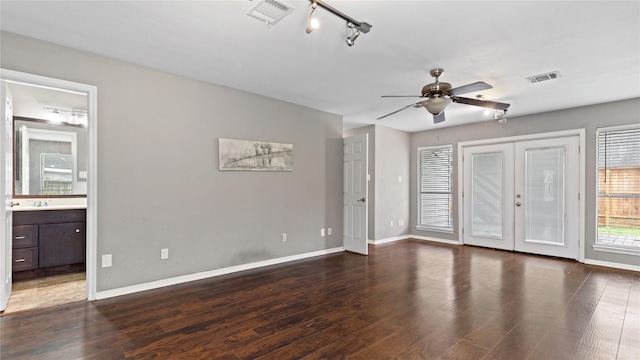 spare room with french doors, rail lighting, sink, dark hardwood / wood-style floors, and ceiling fan