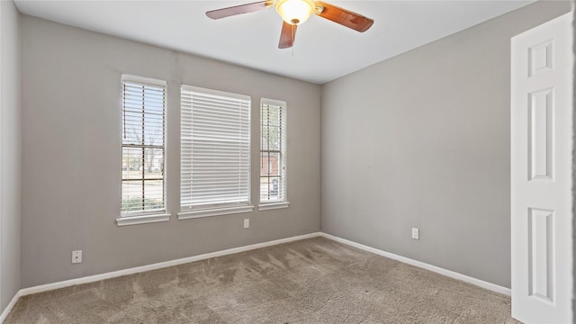 carpeted empty room with ceiling fan