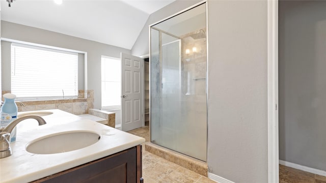 bathroom with lofted ceiling, an enclosed shower, and vanity