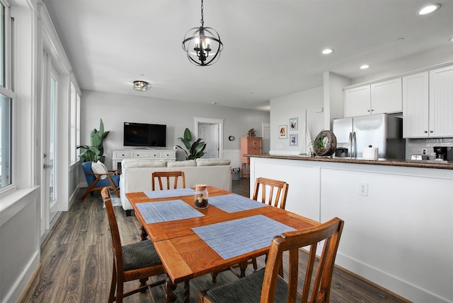 dining room with dark hardwood / wood-style floors