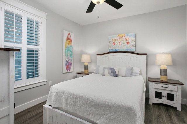 bedroom with ceiling fan and dark hardwood / wood-style flooring