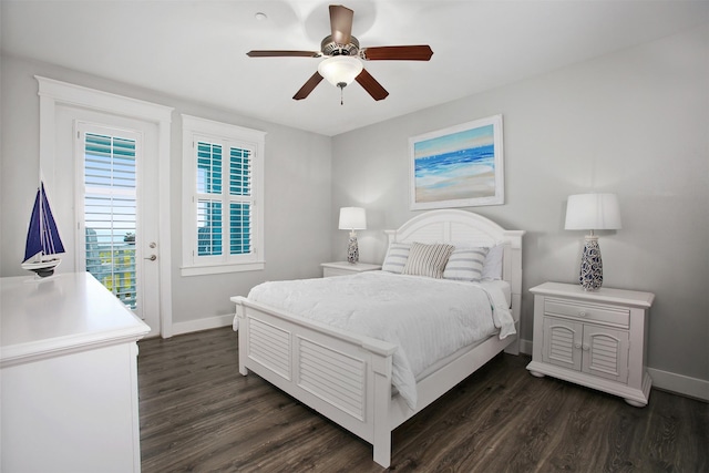 bedroom featuring access to exterior, dark hardwood / wood-style floors, and ceiling fan