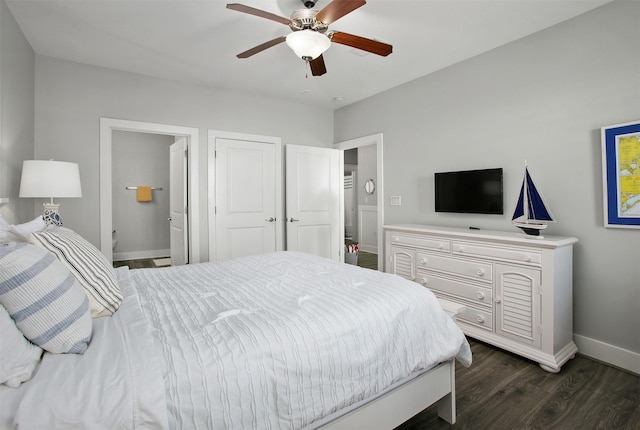 bedroom featuring dark wood-type flooring, connected bathroom, and ceiling fan