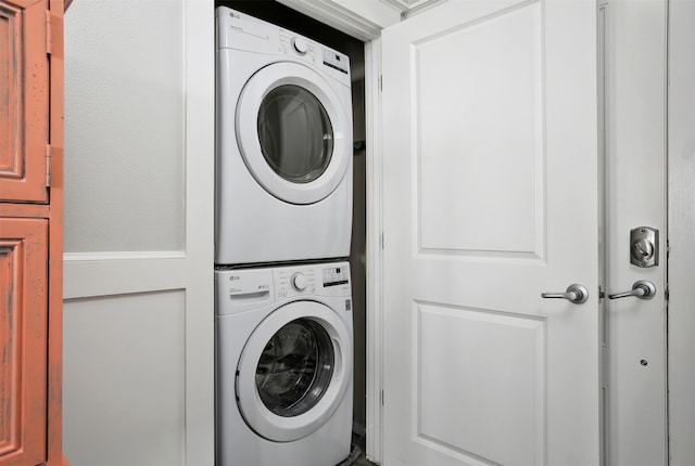 laundry area with stacked washer / drying machine