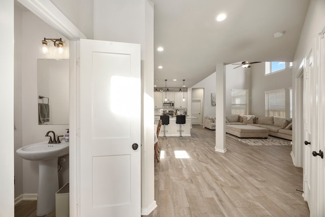 bathroom featuring sink, wood-type flooring, and ceiling fan