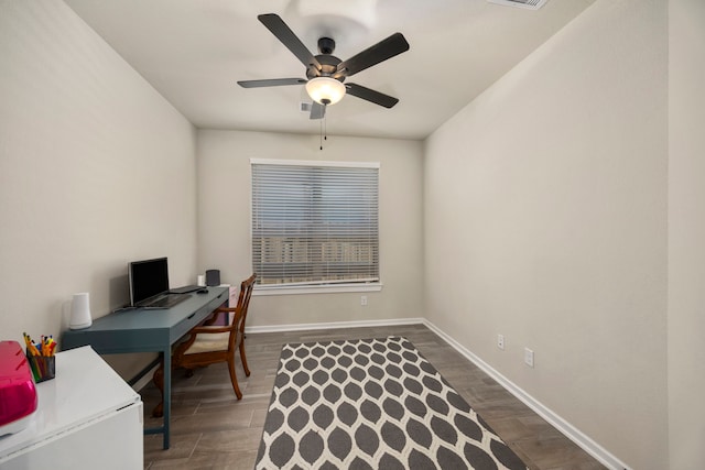 office space with ceiling fan and dark hardwood / wood-style floors