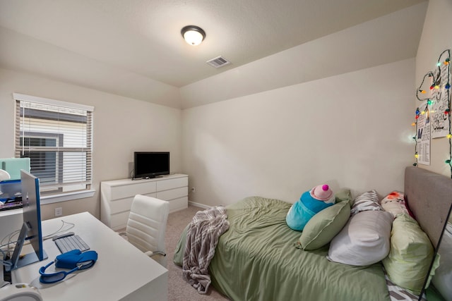 carpeted bedroom featuring lofted ceiling