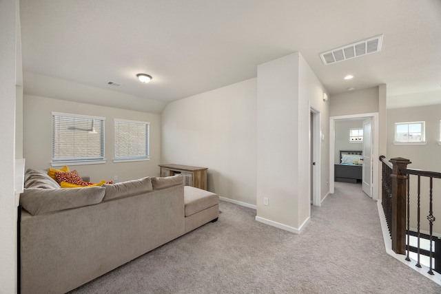 living room featuring light carpet