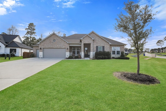 view of front of house with a garage and a front lawn