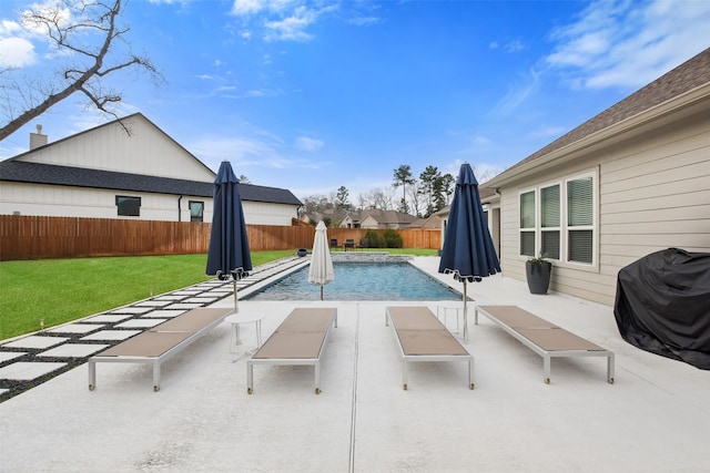 view of pool with a patio, a yard, and grilling area