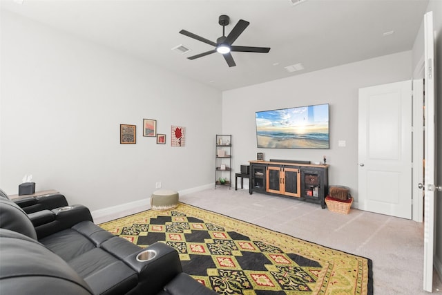 living room featuring light carpet and ceiling fan