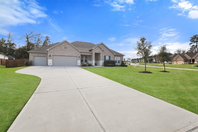 single story home featuring a garage and a front lawn