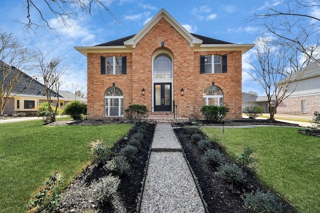 view of front property featuring french doors and a front yard