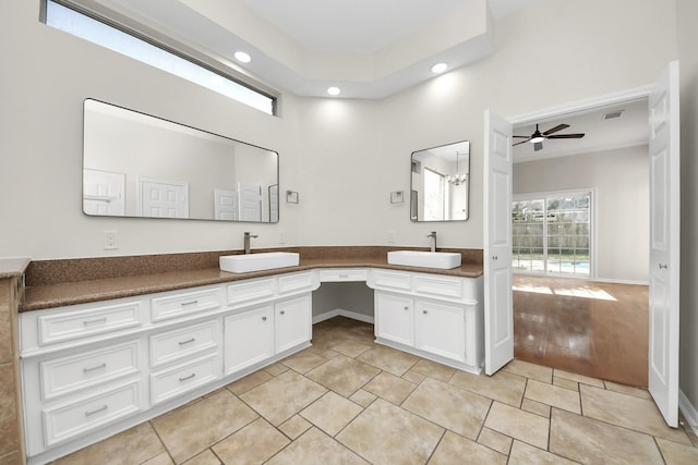 bathroom with tile patterned floors, ceiling fan, and vanity