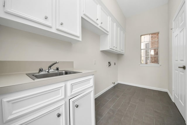 washroom featuring washer hookup, cabinets, and sink