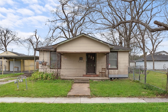 bungalow-style house with a front lawn