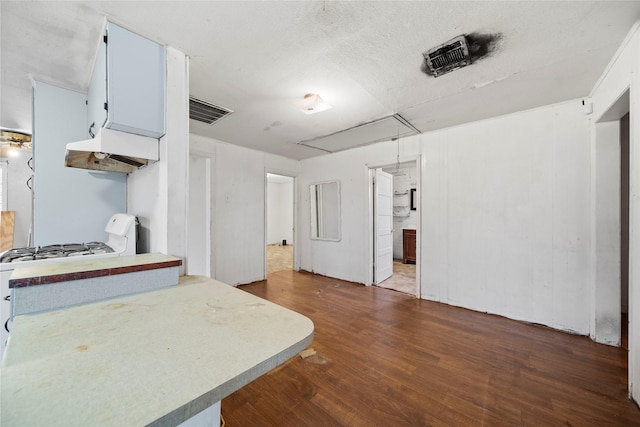 kitchen with dark hardwood / wood-style flooring