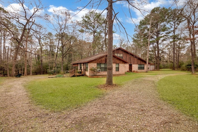 view of side of home featuring a yard