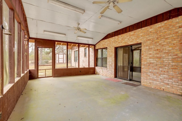 unfurnished sunroom with lofted ceiling and ceiling fan