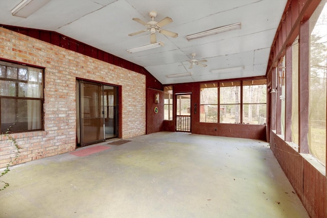 unfurnished sunroom with vaulted ceiling and ceiling fan