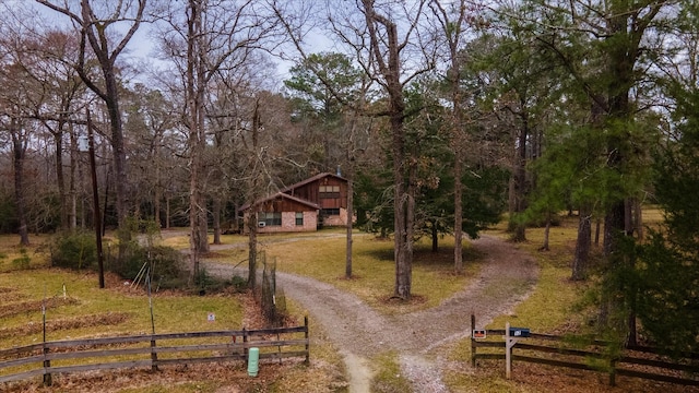 exterior space featuring a yard and a rural view