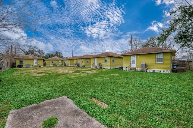 view of yard with central AC