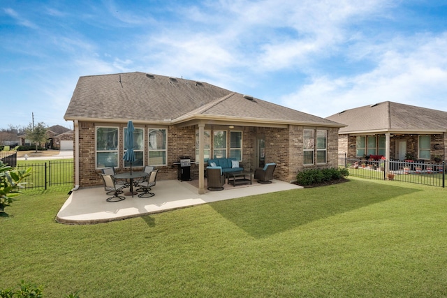 back of house featuring a lawn, outdoor lounge area, and a patio area