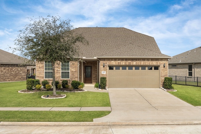 view of front facade with a garage and a front lawn