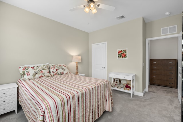 bedroom with ceiling fan and carpet