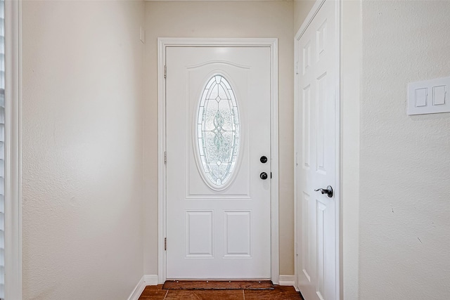 entryway with dark hardwood / wood-style floors