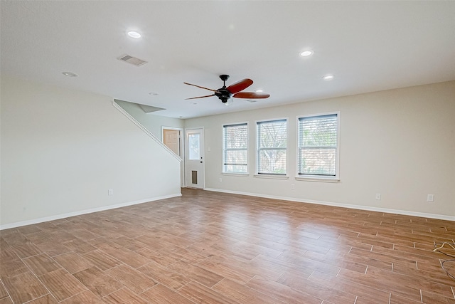 spare room with light hardwood / wood-style floors and ceiling fan