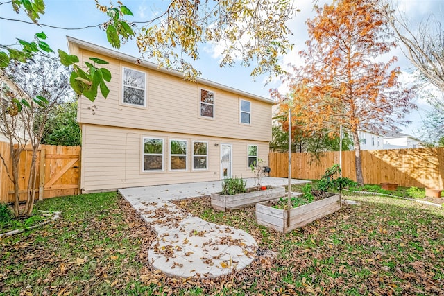 rear view of house featuring a patio area