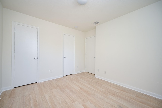 unfurnished bedroom featuring light hardwood / wood-style flooring