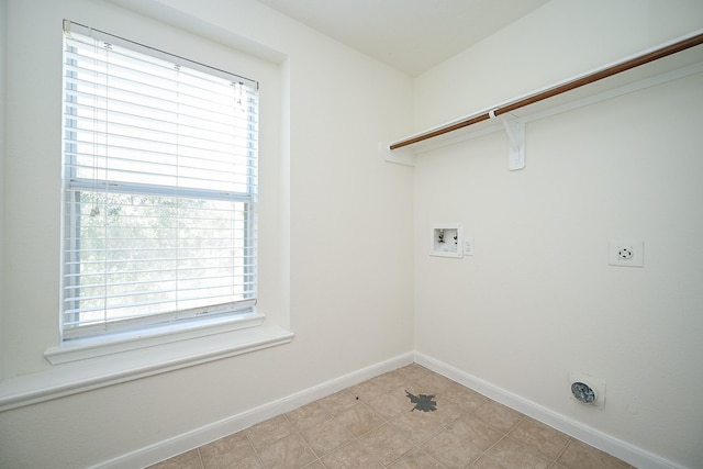 laundry room with plenty of natural light, hookup for a washing machine, and electric dryer hookup