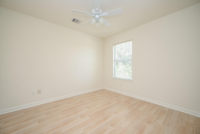 spare room featuring ceiling fan and light wood-type flooring