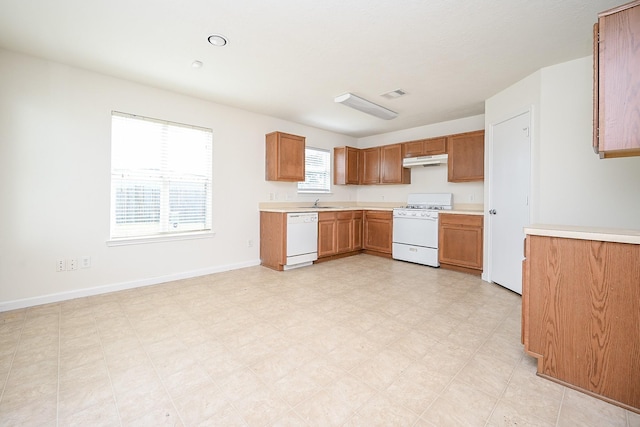 kitchen with sink and white appliances