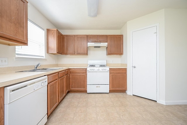 kitchen with sink and white appliances